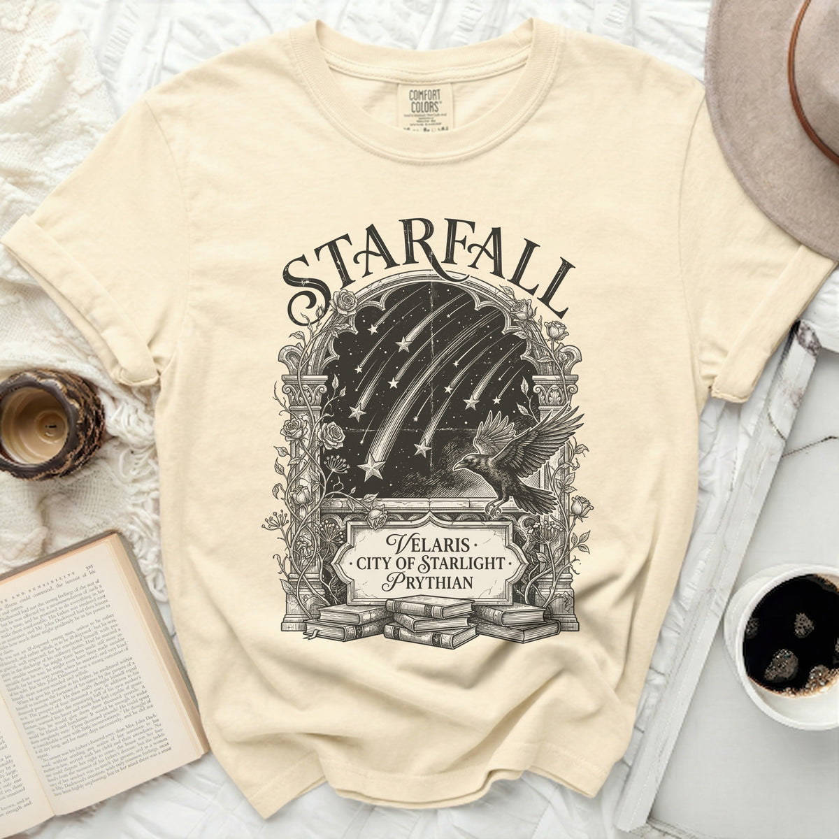 T-shirt with "STARFALL VELARIS CITY OF STARLIGHT PRYTHIAN" graphic and a raven.