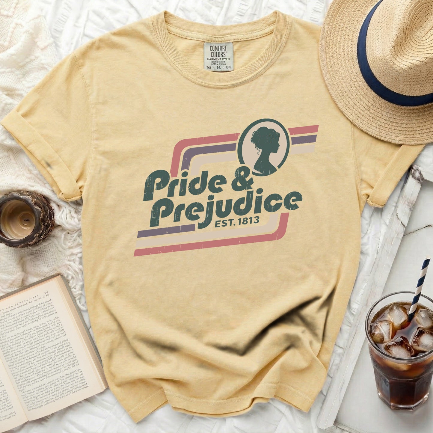 Yellow Comfort Colors t-shirt with "Pride & Prejudice est. 1813" graphic.