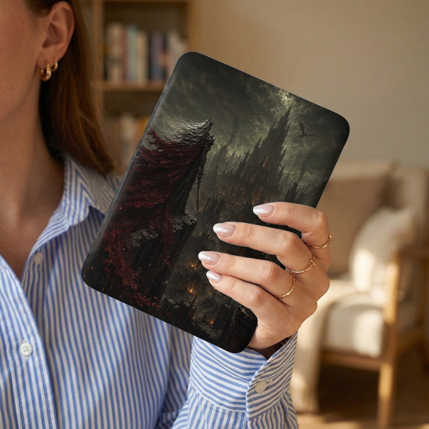 Themed digital notebook with knight and castle art, held by a woman.