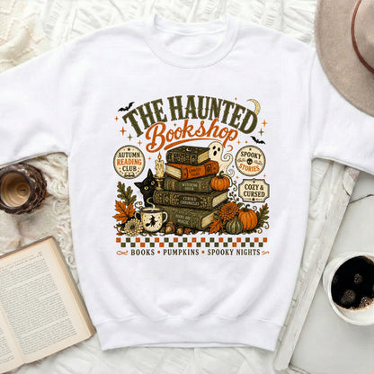 The Haunted Bookshop graphic on a white sweatshirt with Halloween elements.