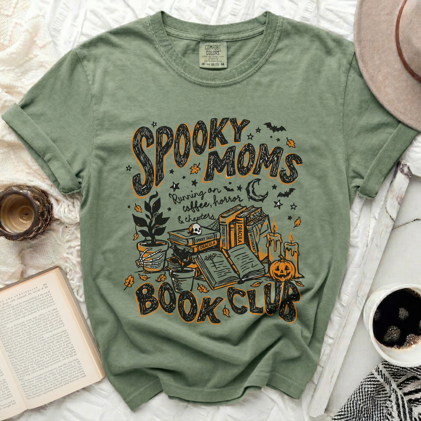 Green t-shirt with "Spooky Moms Book Club" Halloween graphic.