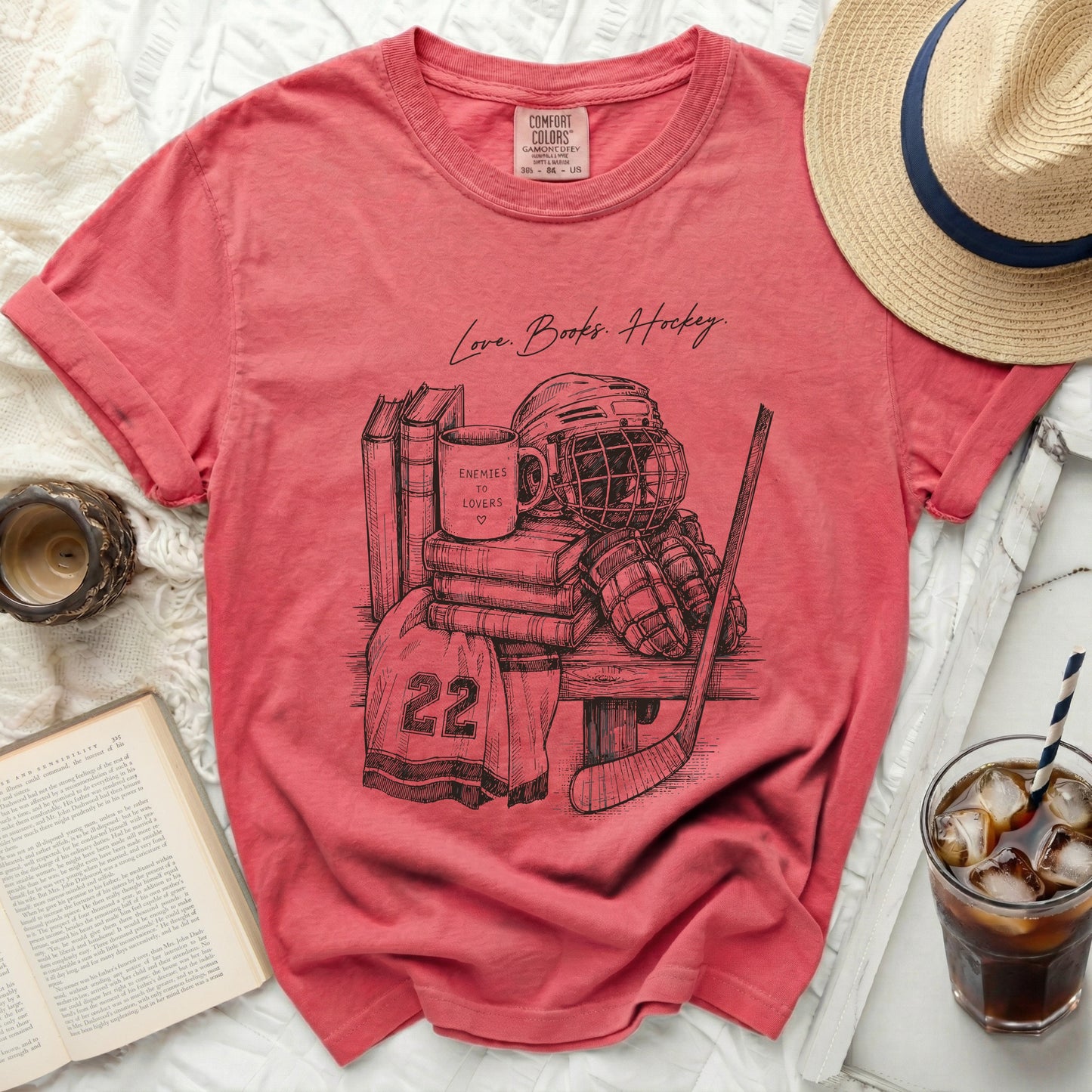 T-shirt with sketch of hockey gear, books, and "Love Books. Hockey." text.