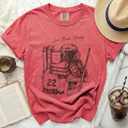 T-shirt with sketch of hockey gear, books, and "Love Books. Hockey." text.