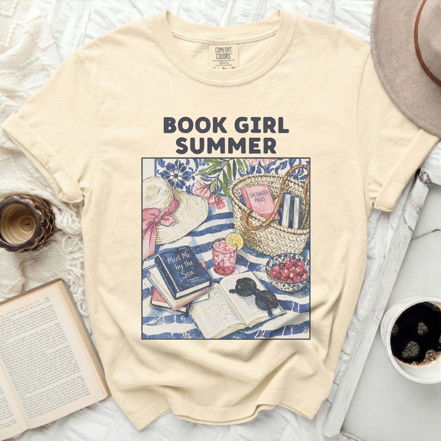 Yellow t-shirt with "Book Girl Summer" text and beach reading flat lay.