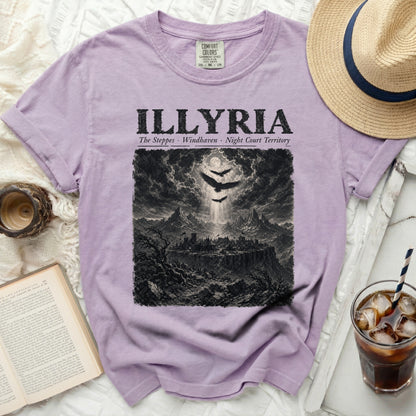 Lilac t-shirt with "ILLYRIA" text and dark fantasy landscape graphic.
