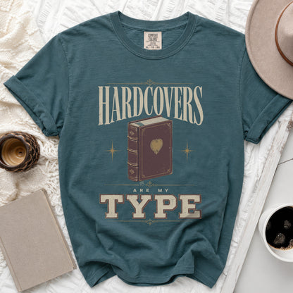 Teal t-shirt with "Hardcovers Are My Type" text and a vintage book graphic.