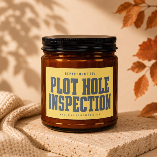 Amber jar candle with yellow label reading "DEPARTMENT OF: PLOT HOLE INSPECTION".