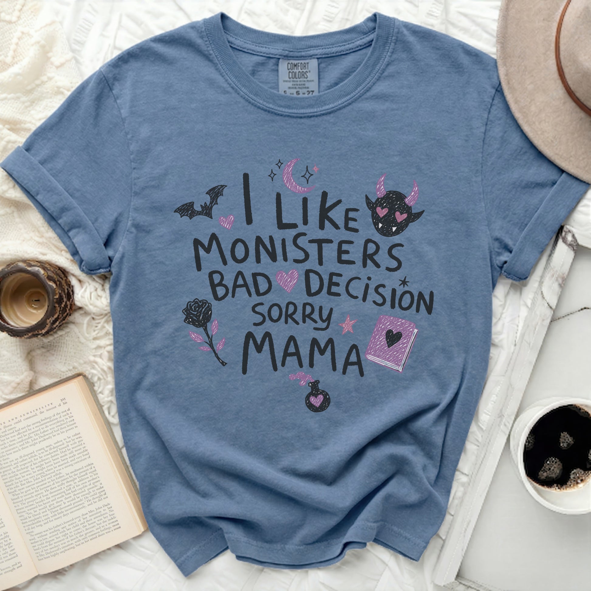 Blue t-shirt with "I Like Monsters Bad Decision Sorry Mama" graphic.