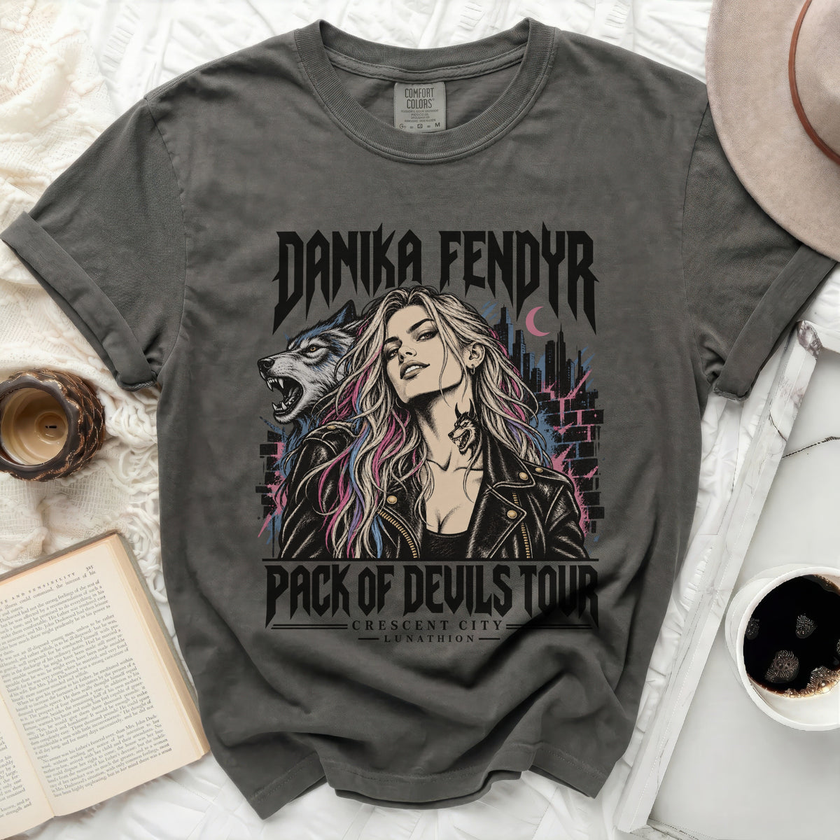 Danika Fendyr Pack of Devils Tour t-shirt with wolf and city graphic.