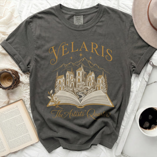 Dark grey t-shirt with gold "Velaris The Artists Quarter" graphic.