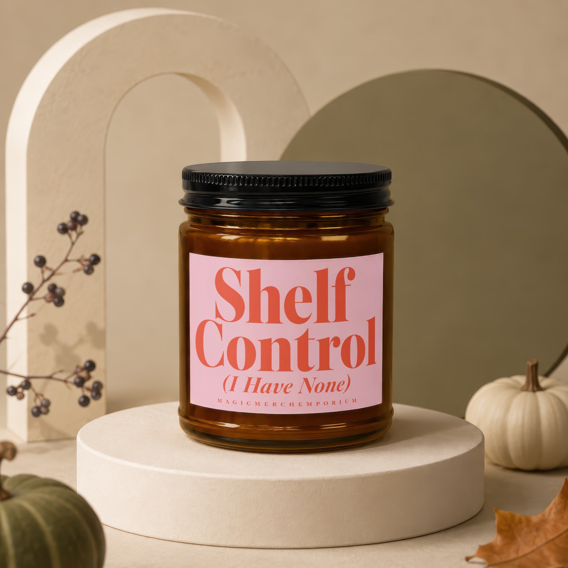 Amber jar candle with "Shelf Control (I Have None)" text on a pink label.
