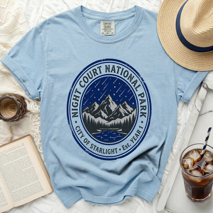 Light blue t-shirt with a circular graphic for Night Court National Park City of Starlight.