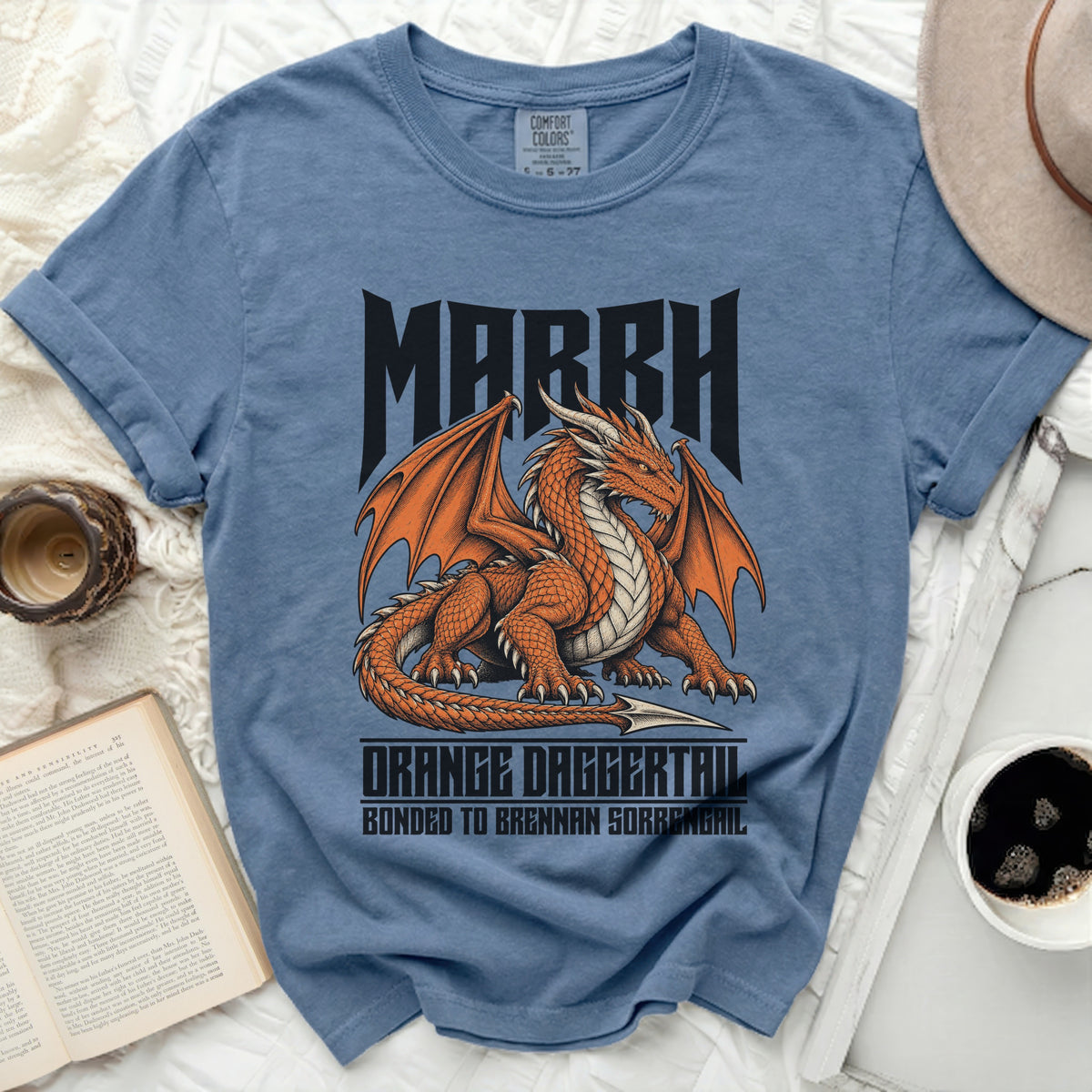 Blue t-shirt with "MARRH" and an orange dragon graphic.