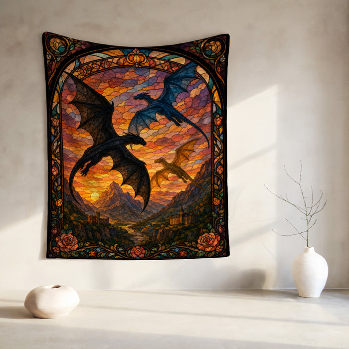 Stained glass tapestry featuring dragons over a mountain landscape at sunset.