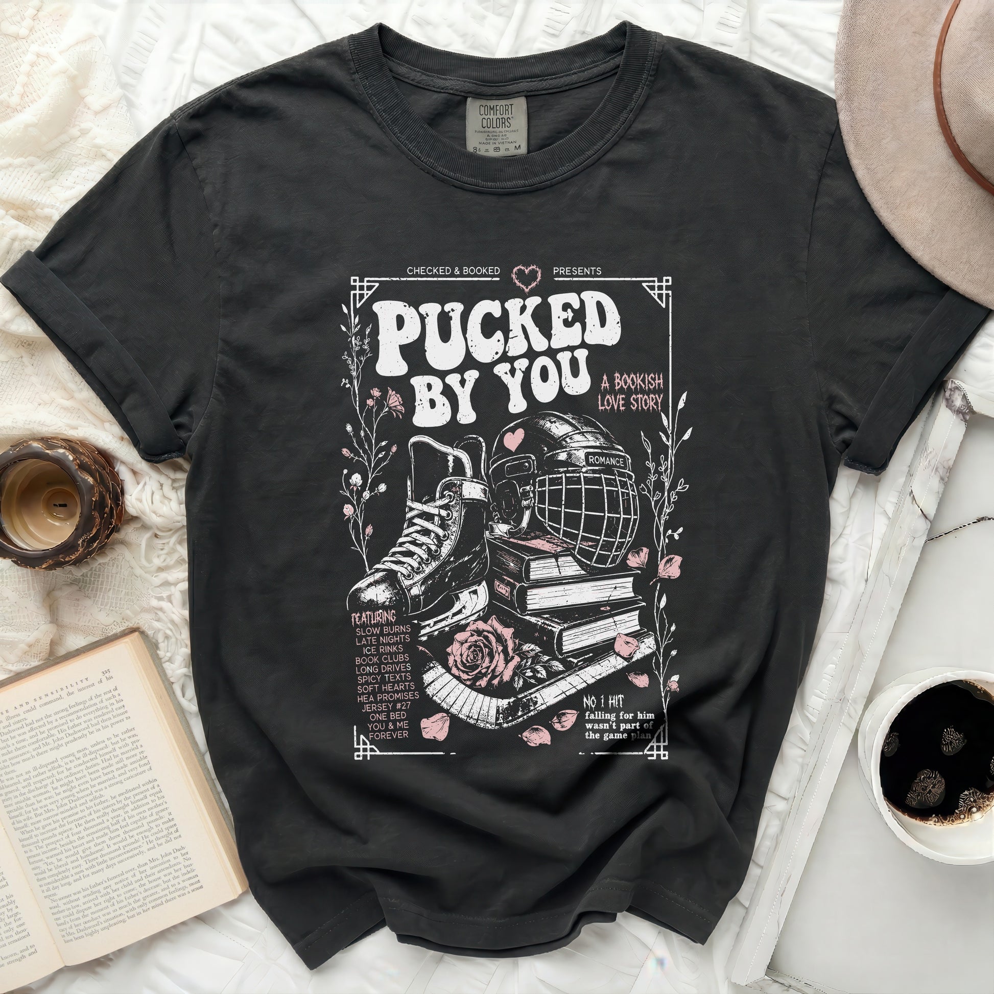 T-shirt with "Pucked By You" hockey romance book design.