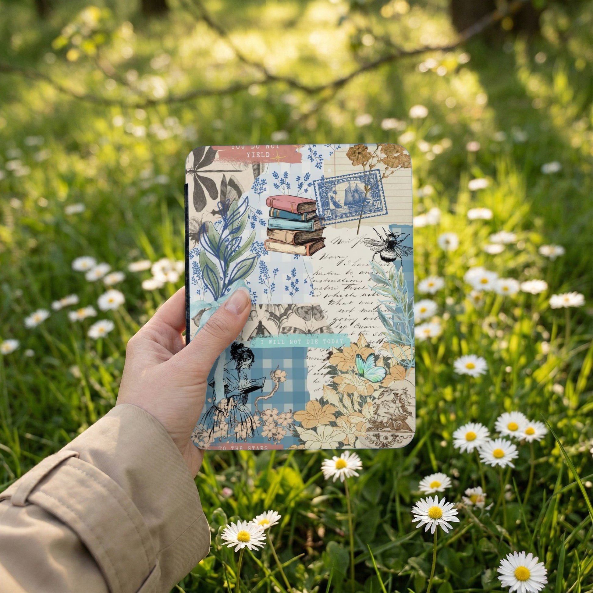 Collage art journal with books, stamps, and text "I WILL NOT DIE TODAY".