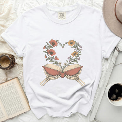 White t-shirt with heart of flowers illustration from an open book.