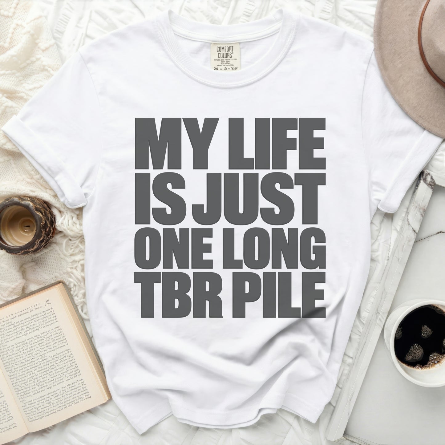 White t-shirt with gray text "MY LIFE IS JUST ONE LONG TBR PILE".