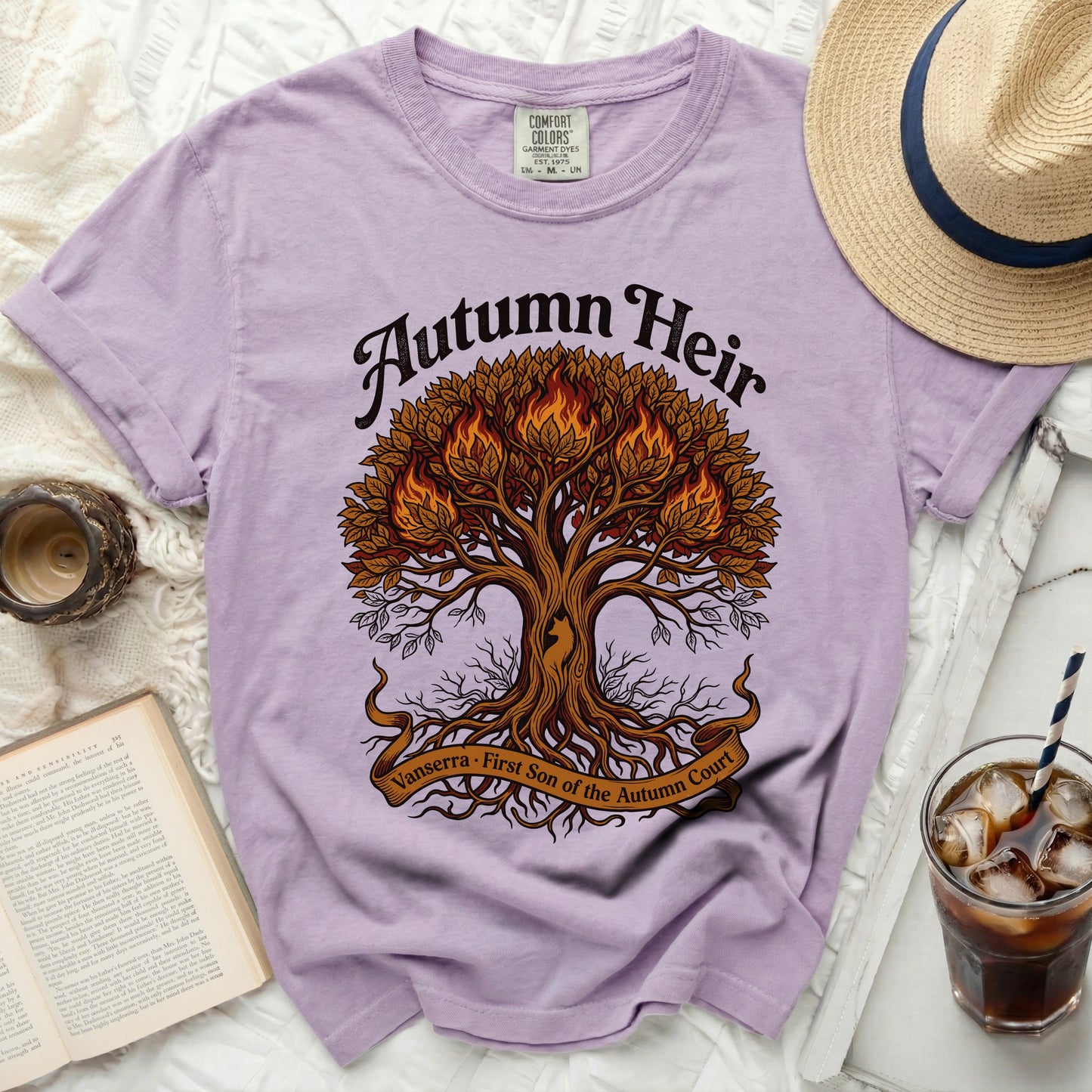 Purple t-shirt with "Autumn Heir" and a fiery tree design.