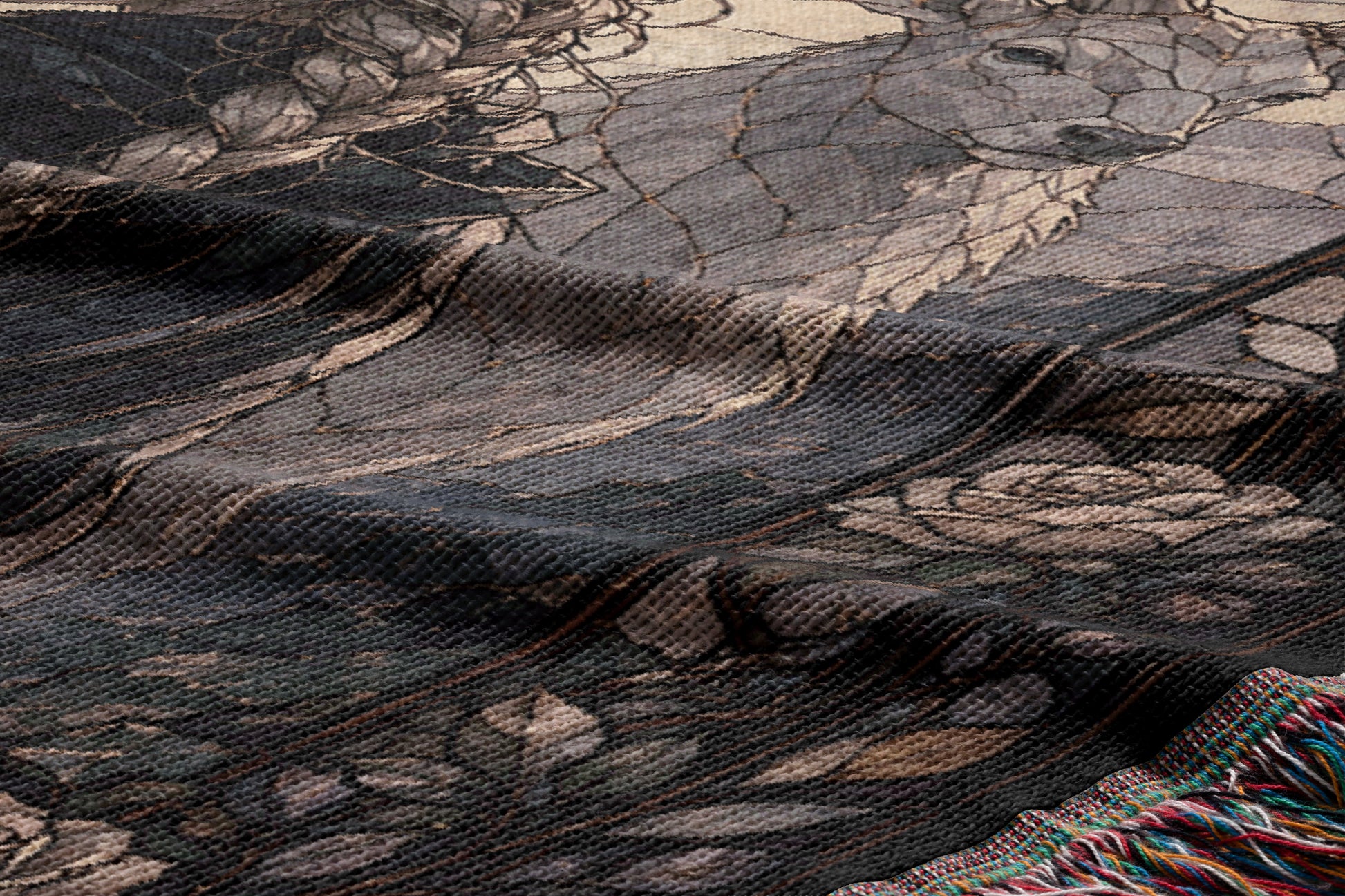 a close-up view of a textured fabric with a floral pattern. The fabric appears to be a woven or knitted material, with a dark background and a lighter, more intricate floral design in the center.