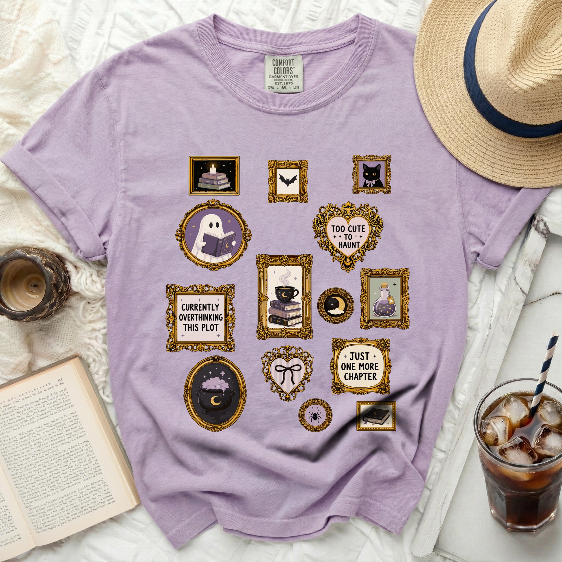Purple t-shirt with embroidered frames featuring Halloween themes and book quotes.