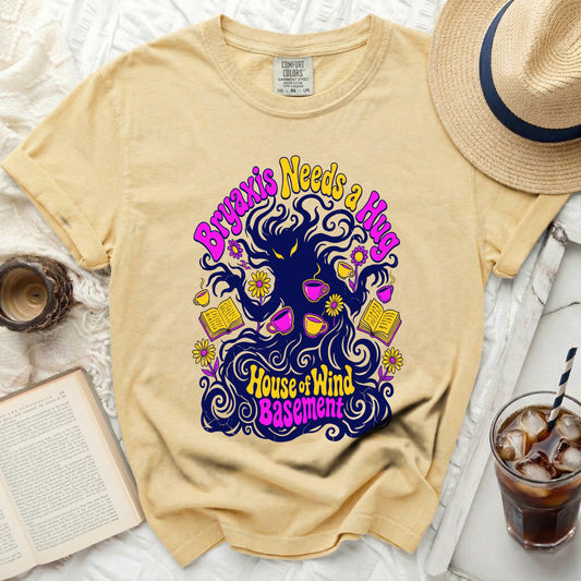 Yellow t-shirt with "Bryaxis Needs a Hug" and "House of Wind Basement" graphic.