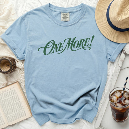 Light blue Comfort Colors t-shirt with green "ONE MORE!" text.