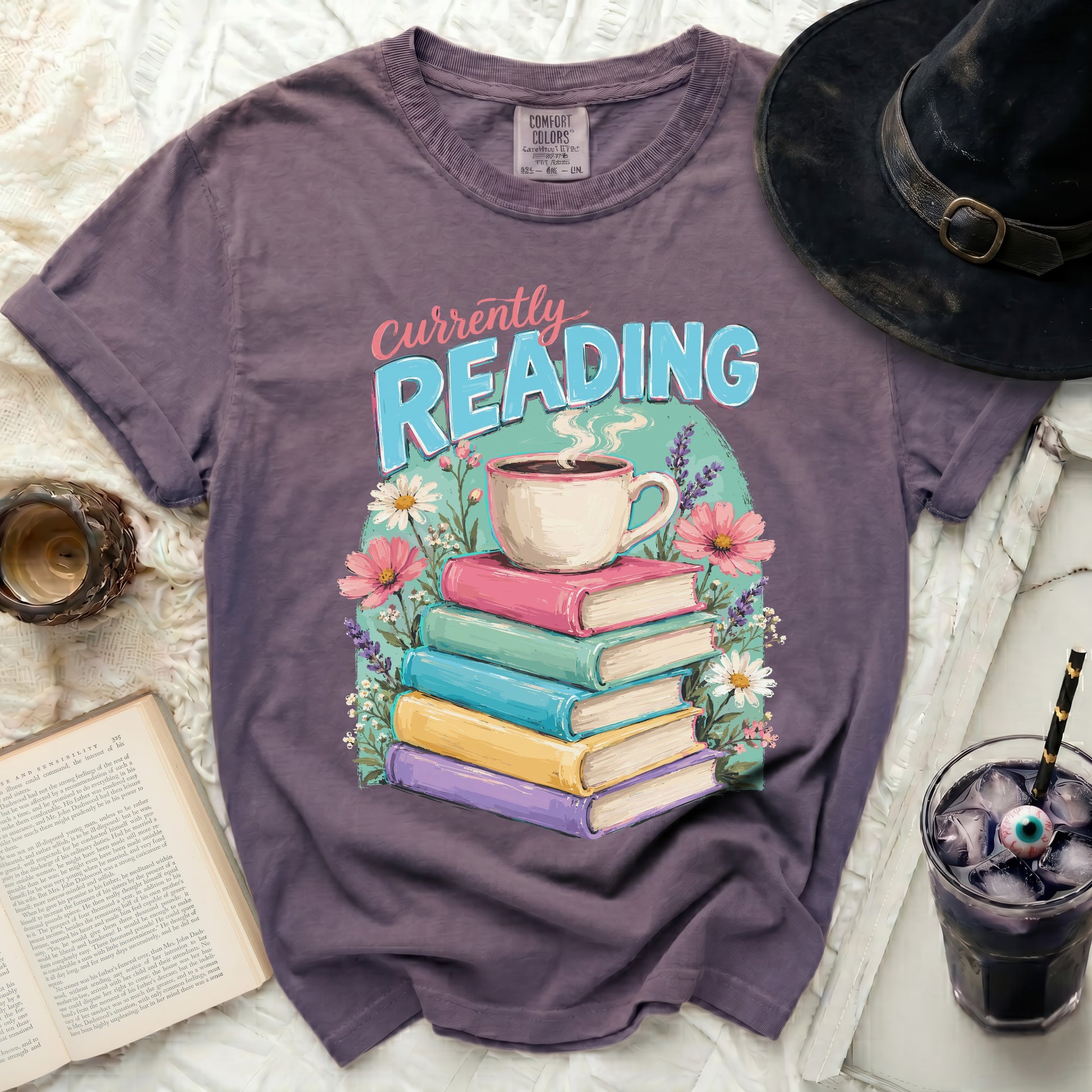Purple t-shirt with "Currently Reading" text and stack of books.