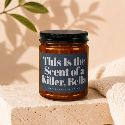 Candle with text "This Is the Scent of a Killer, Bella" and "MAGICMERCH`EMPORIUM".