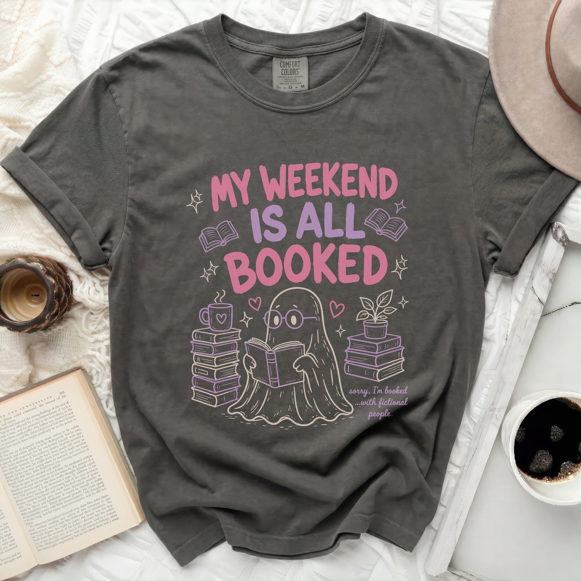 Dark grey t-shirt with "My weekend is all booked" and a ghost reading.
