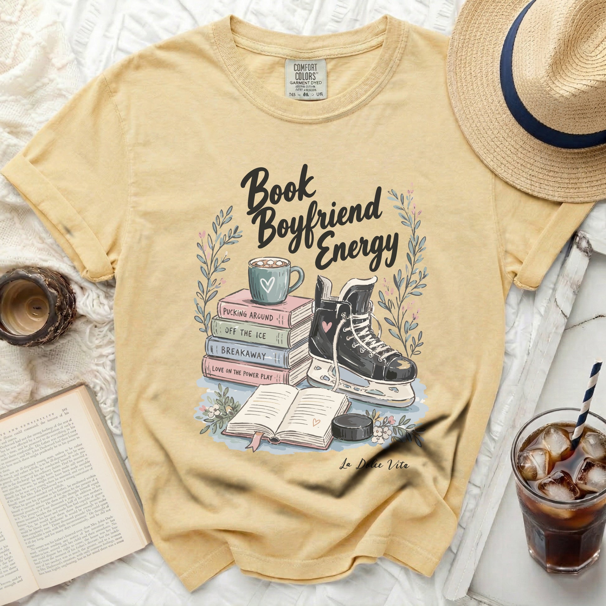 Yellow t-shirt with "Book Boyfriend Energy" text and hockey graphics.