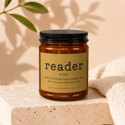 Amber jar candle with "reader" definition label.