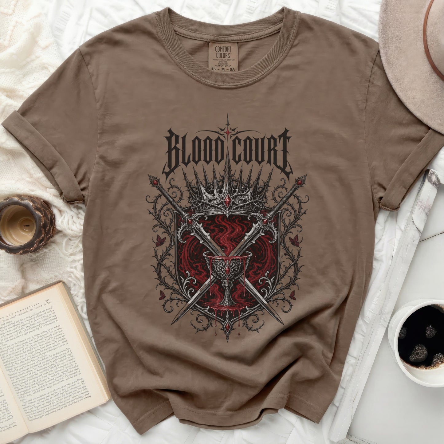 Brown t-shirt with "Blood Court" graphic featuring swords and a crown.