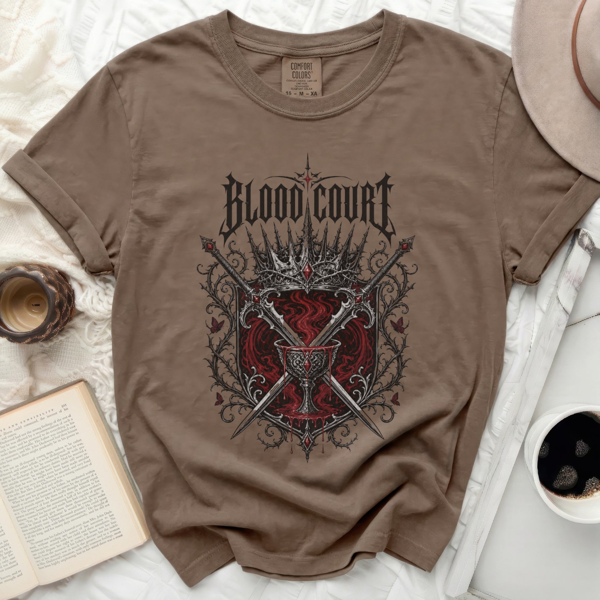 Brown t-shirt with "Blood Court" graphic featuring swords and a crown.