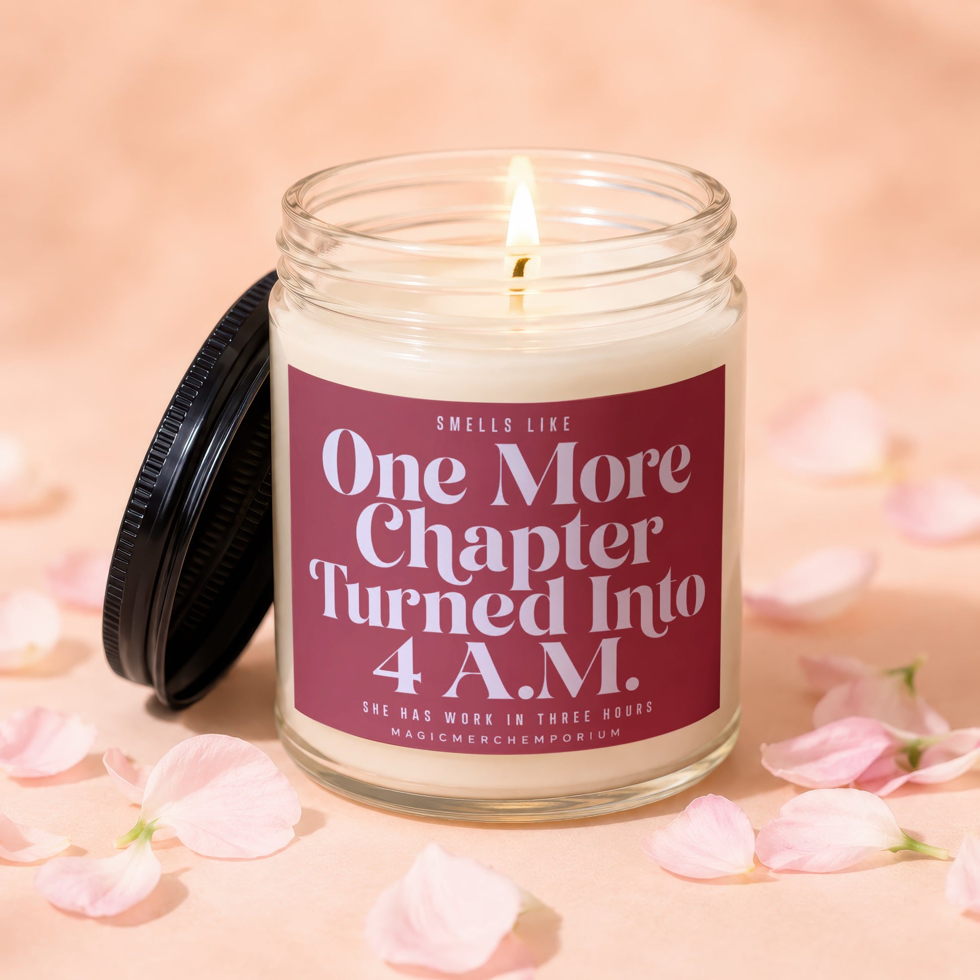 Lit candle in glass jar with dark lid, reads "One More Chapter Turned Into 4 A.M."