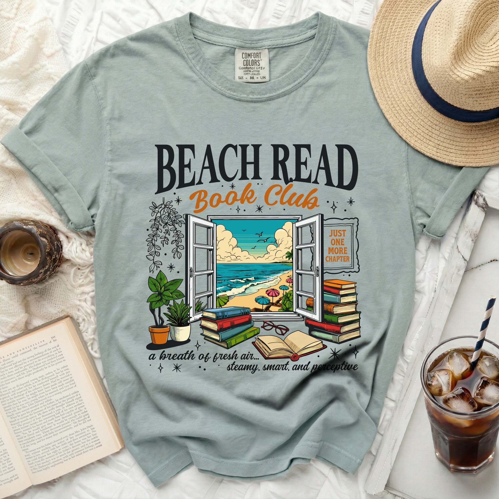 Beach Read Book Club t-shirt with open window overlooking beach and books.