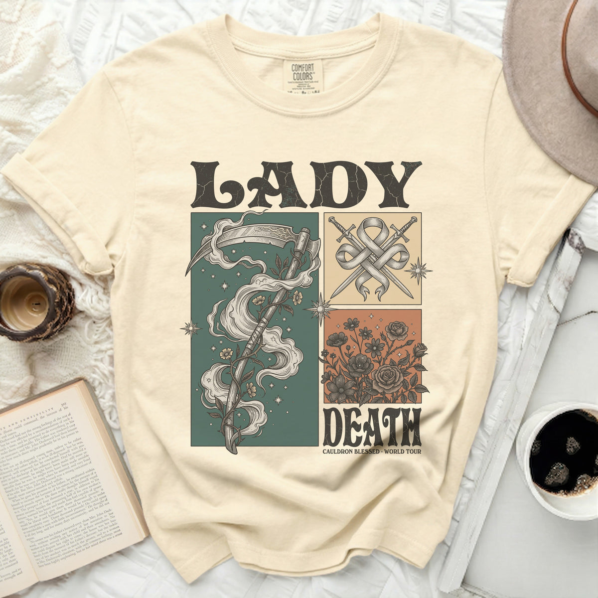 Cream t-shirt with "Lady Death" graphic featuring scythe, swords, and flowers.