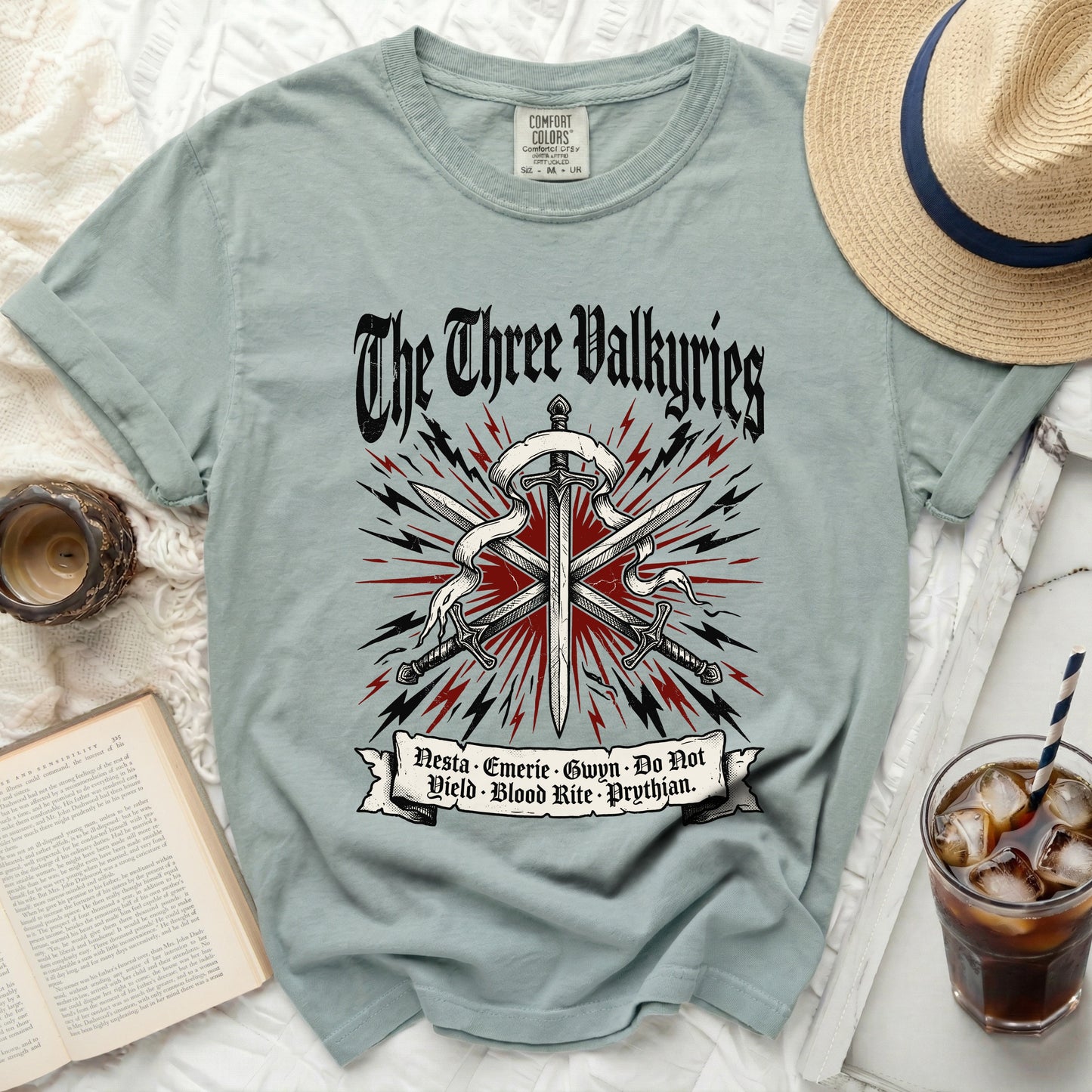 Light blue t-shirt with "The Three Valkyries" and sword graphic.
