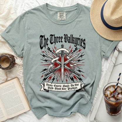 Light blue t-shirt with "The Three Valkyries" and sword graphic.