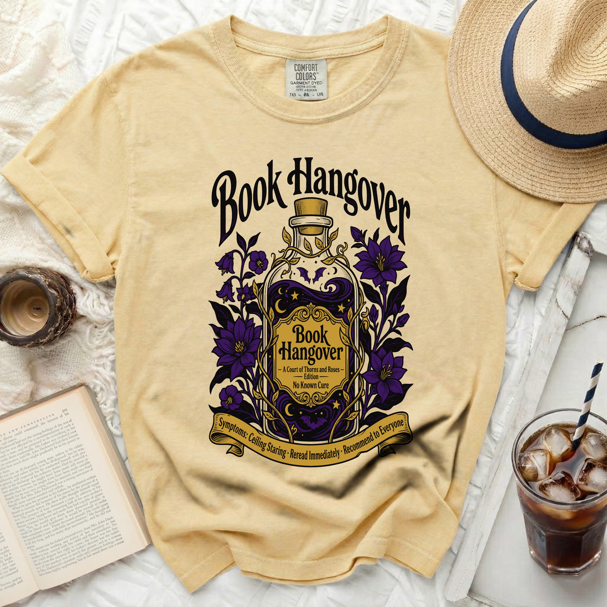 Yellow t-shirt with "Book Hangover" text and potion bottle graphic.