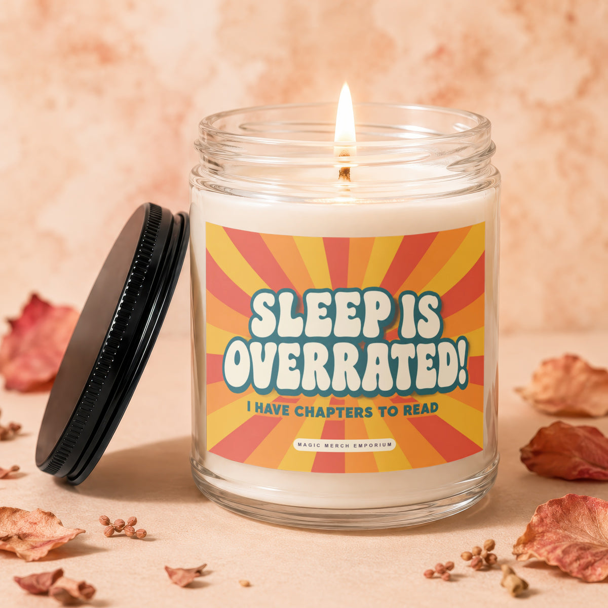 A lit candle in a glass jar with a label reading Sleep is Overrated.