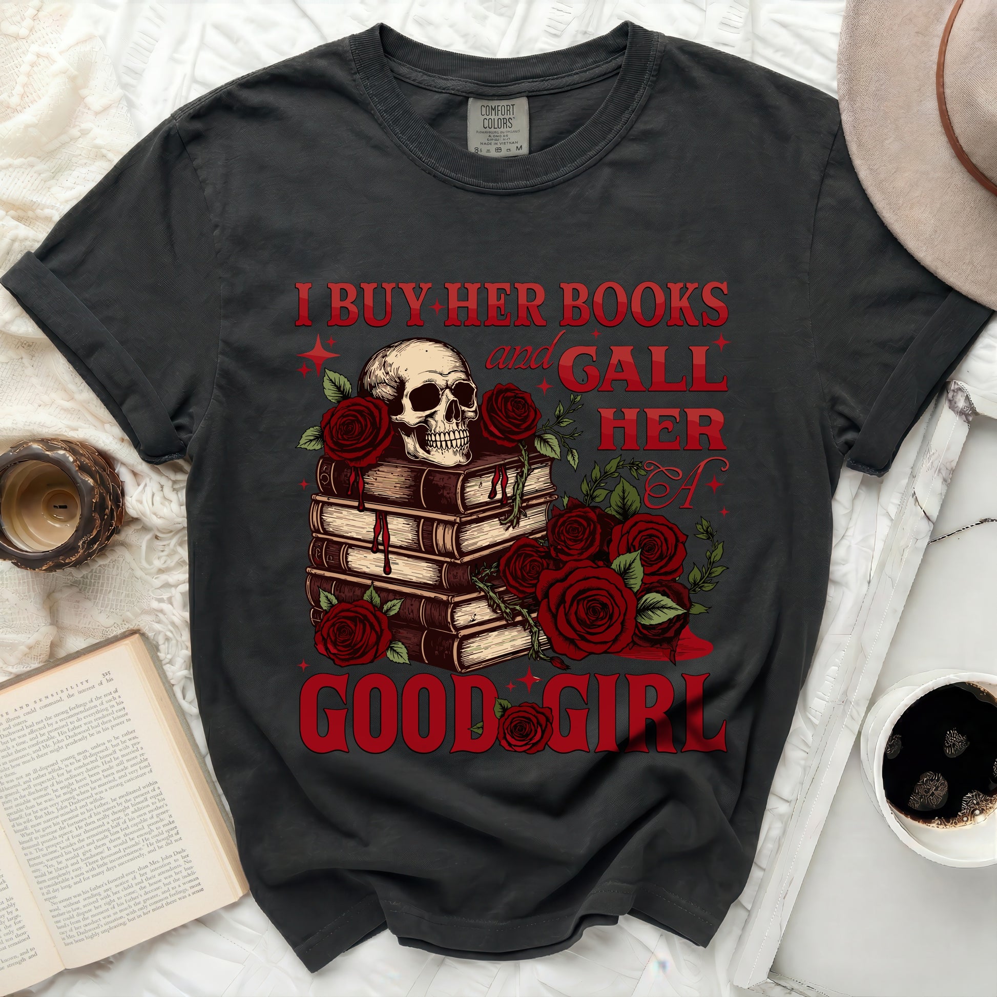 Dark gray t-shirt with skull, books, and roses graphic and text.