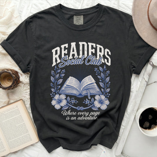 Black t-shirt with "Readers Social Club" and an open book with floral wreath.