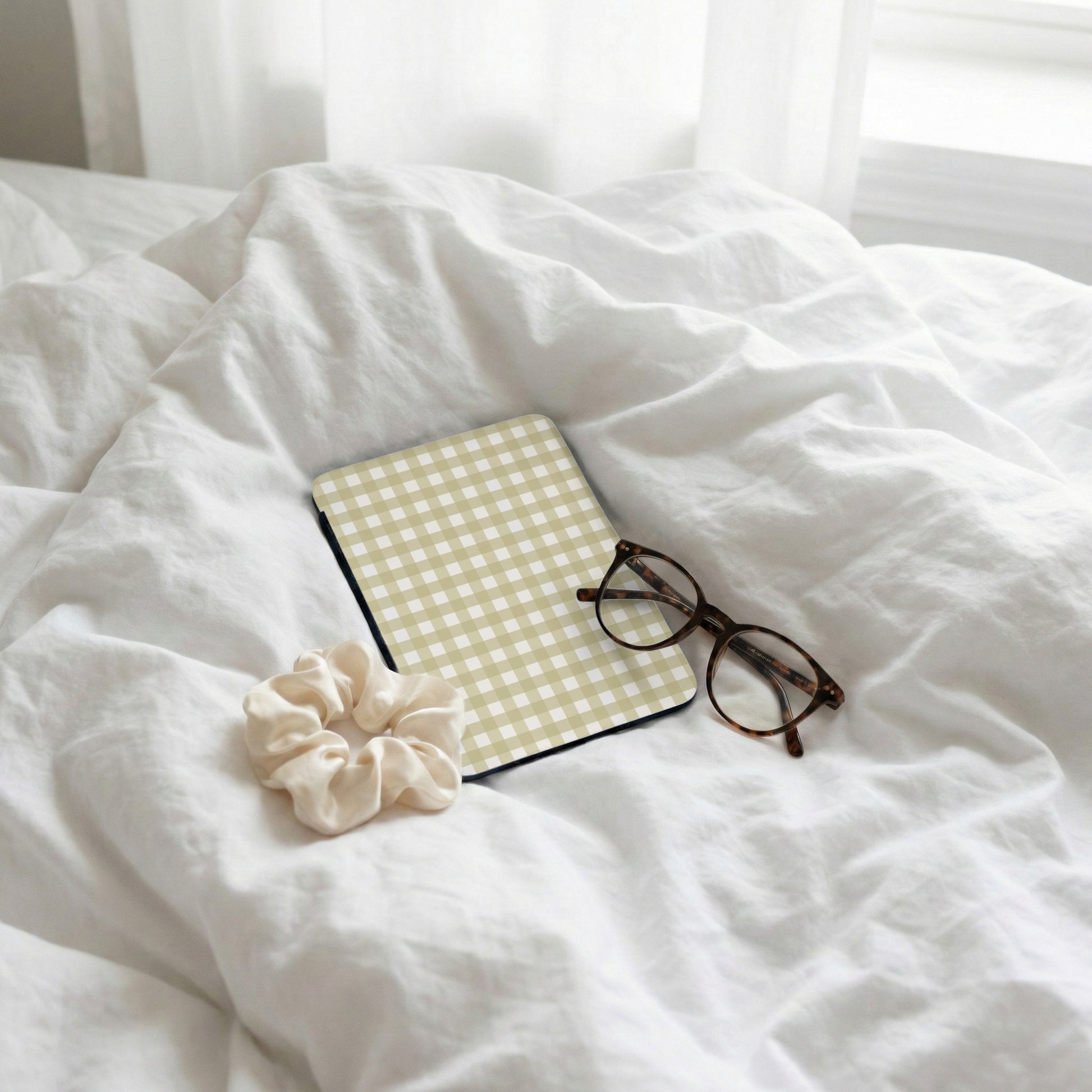 Beige Checkered Mouse Pad with Glasses and Hair Tie Scene