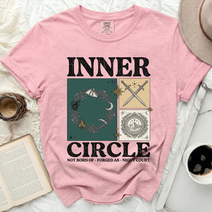 Pink t-shirt with "INNER CIRCLE" graphic, featuring moon, swords, and mountains.
