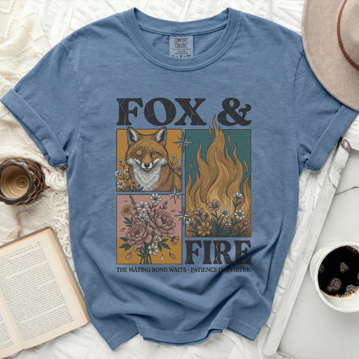 Blue t-shirt with "Fox & Fire" graphic, featuring a fox, flames, and flowers.