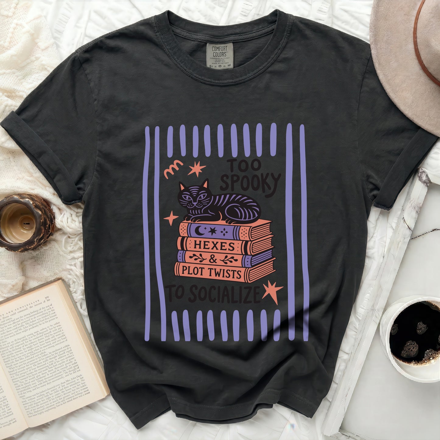 Black t-shirt with "Too Spooky to Socialize" graphic featuring a cat on books.