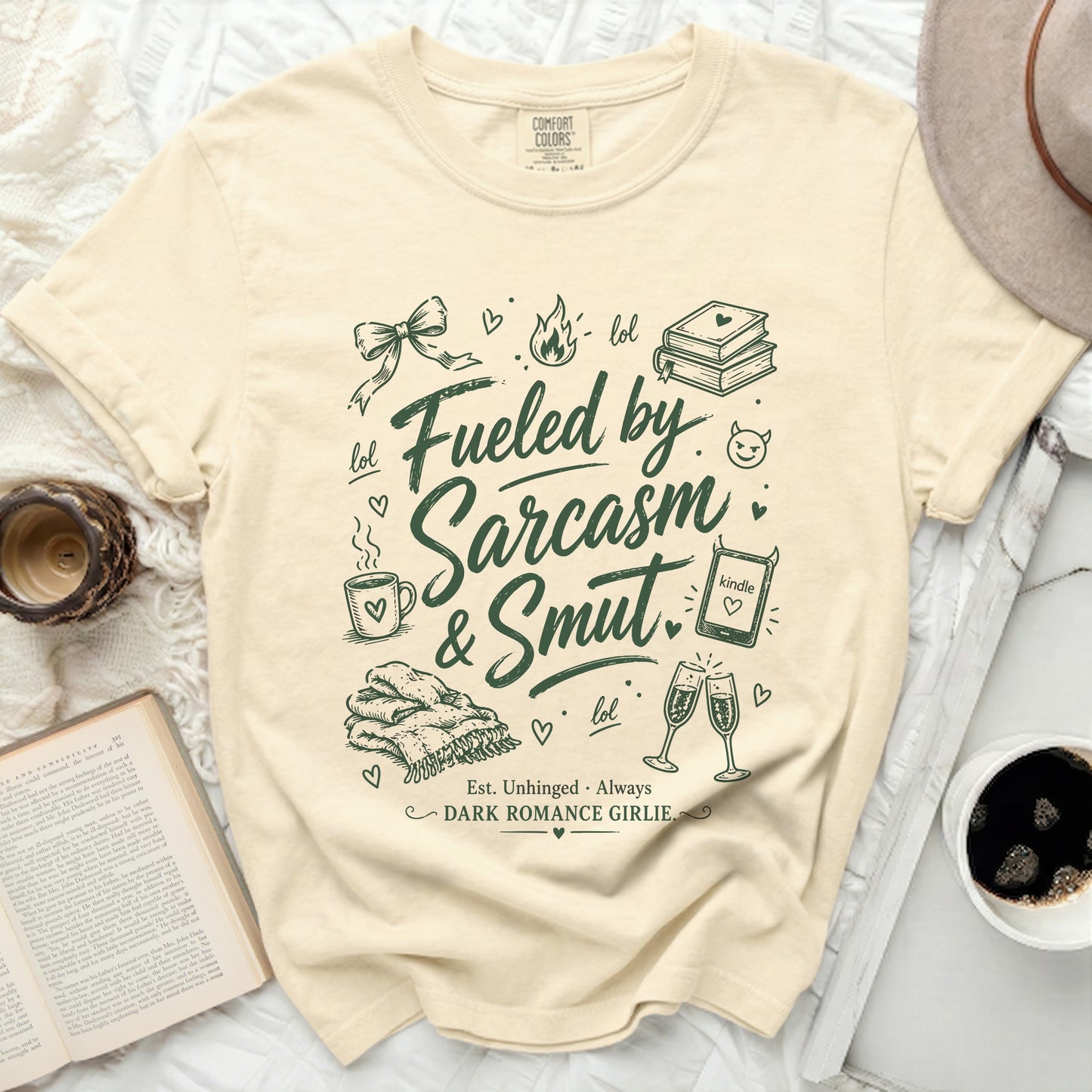 Cream t-shirt with "Fueled by Sarcasm & Smut" and "DARK ROMANCE GIRLIE" text.