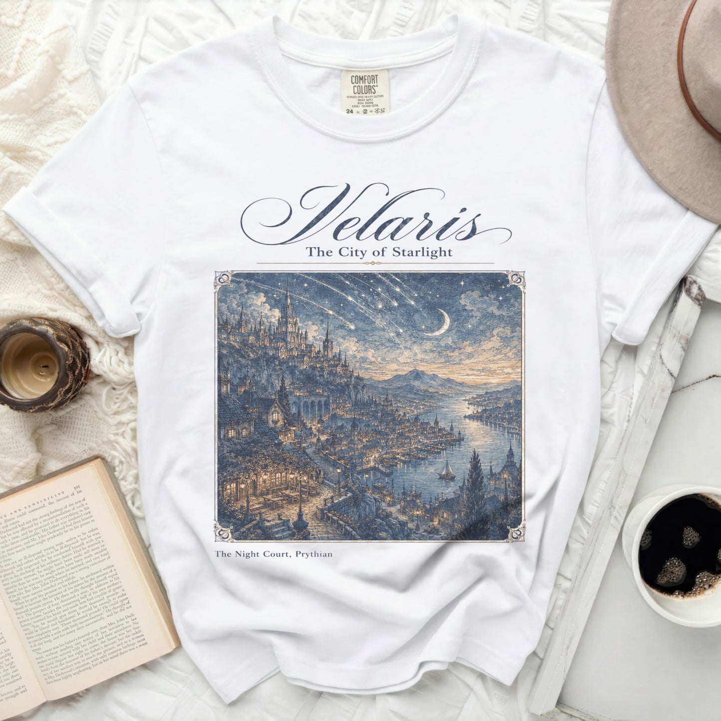 White t-shirt with "Velaris The City of Starlight" and fantastical city art.