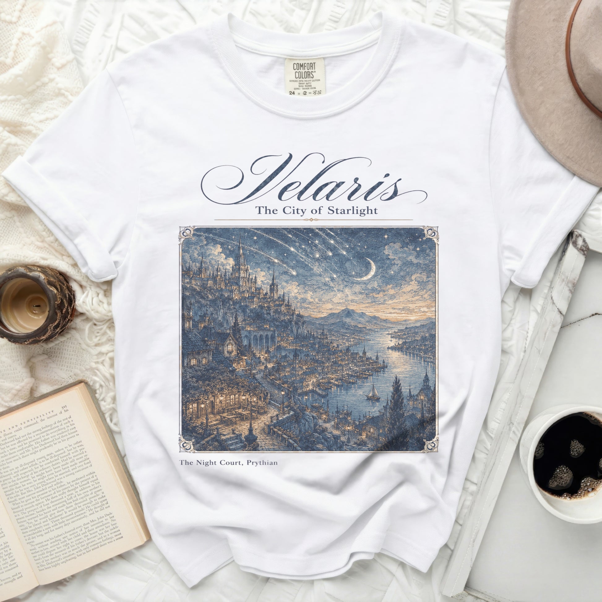 White t-shirt with "Velaris The City of Starlight" and fantastical city art.